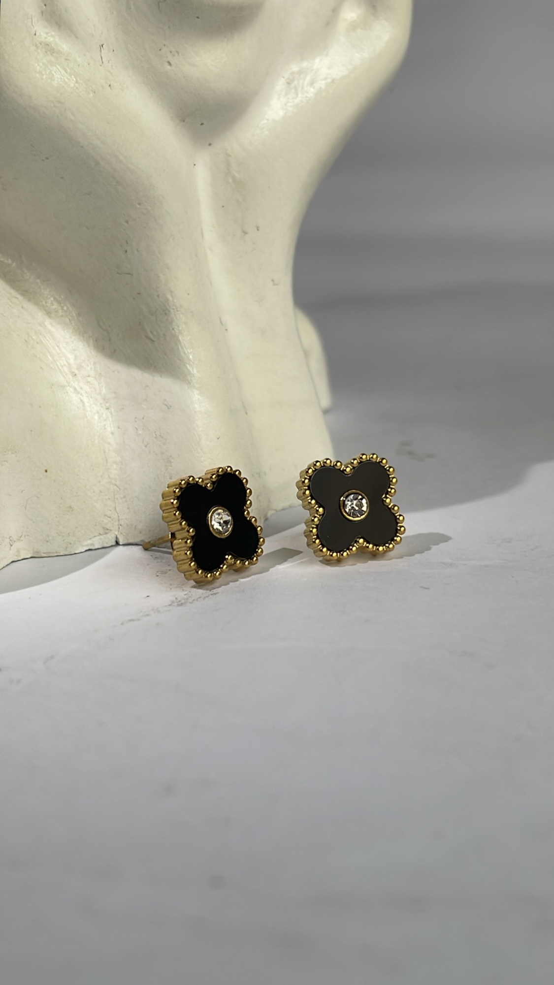 noir clover studs. noir clover studs.
